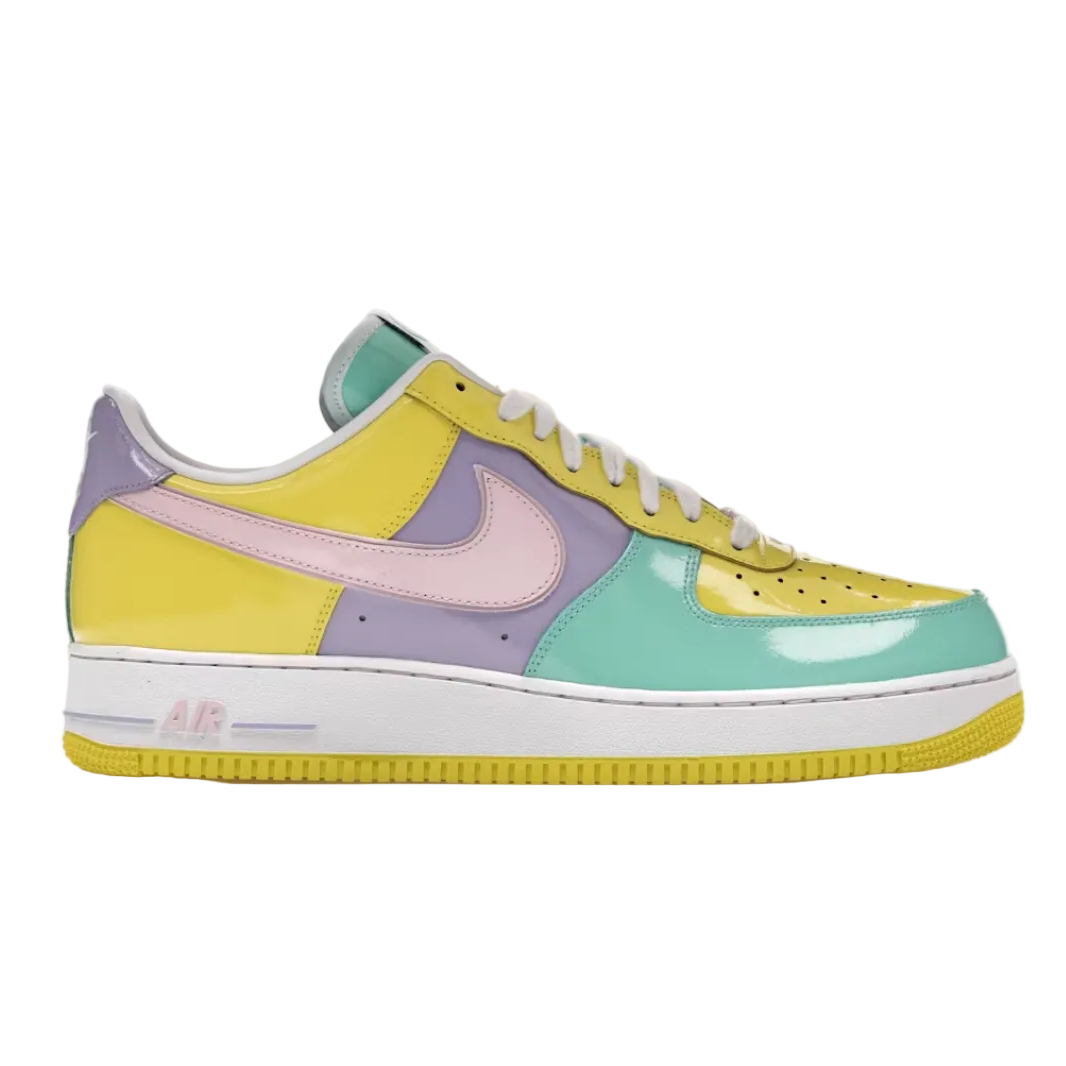 A multicolor Nike Air Force 1 Low sneaker with pastel yellow, mint green, lavender purple, and light pink panels, shown in a side profile on a white background.
