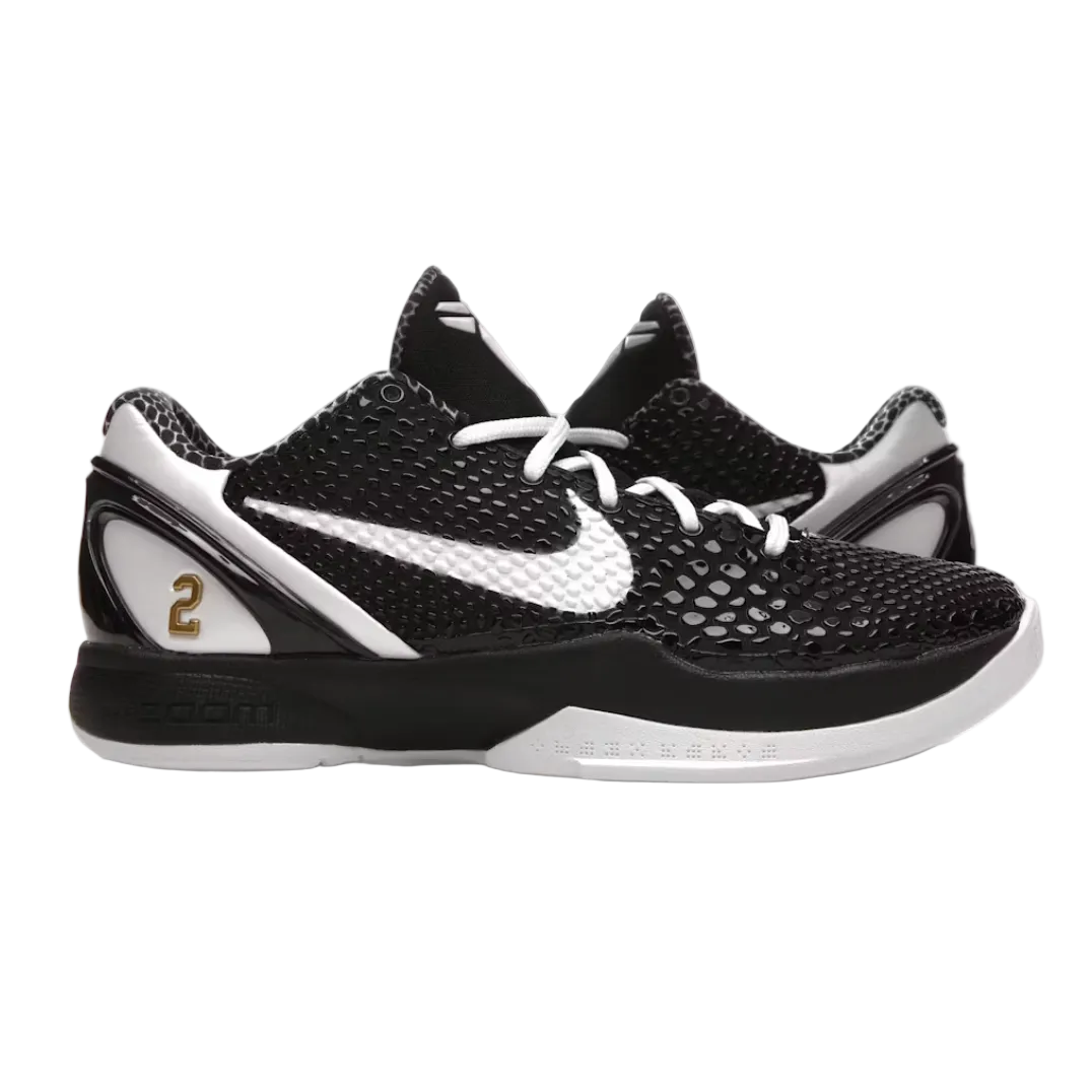 Black and white Nike basketball shoes with a gold number 2 on the heel, shown against a plain white background.