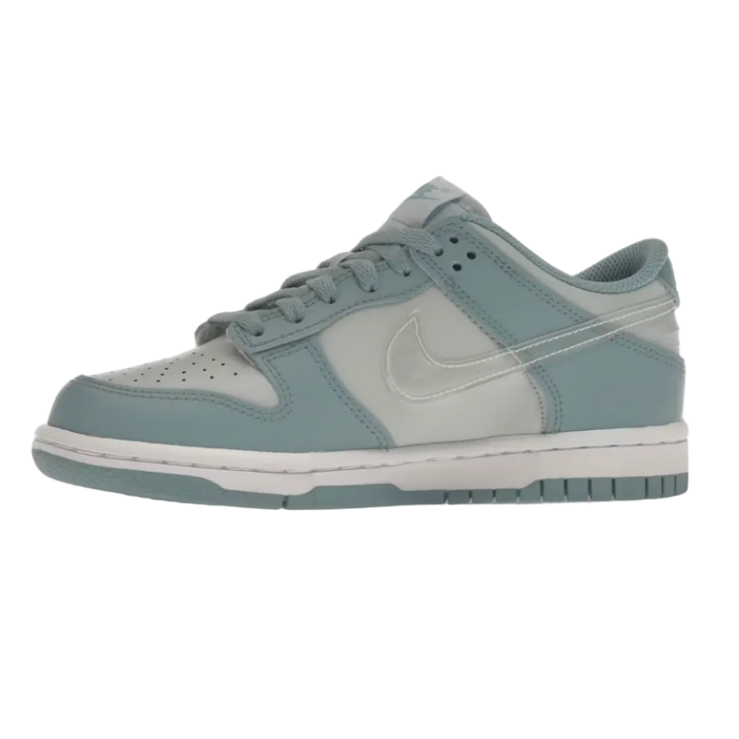 A Nike Dunk sneaker in a muted light blue and white colorway, shown from the side profile on a plain white background.