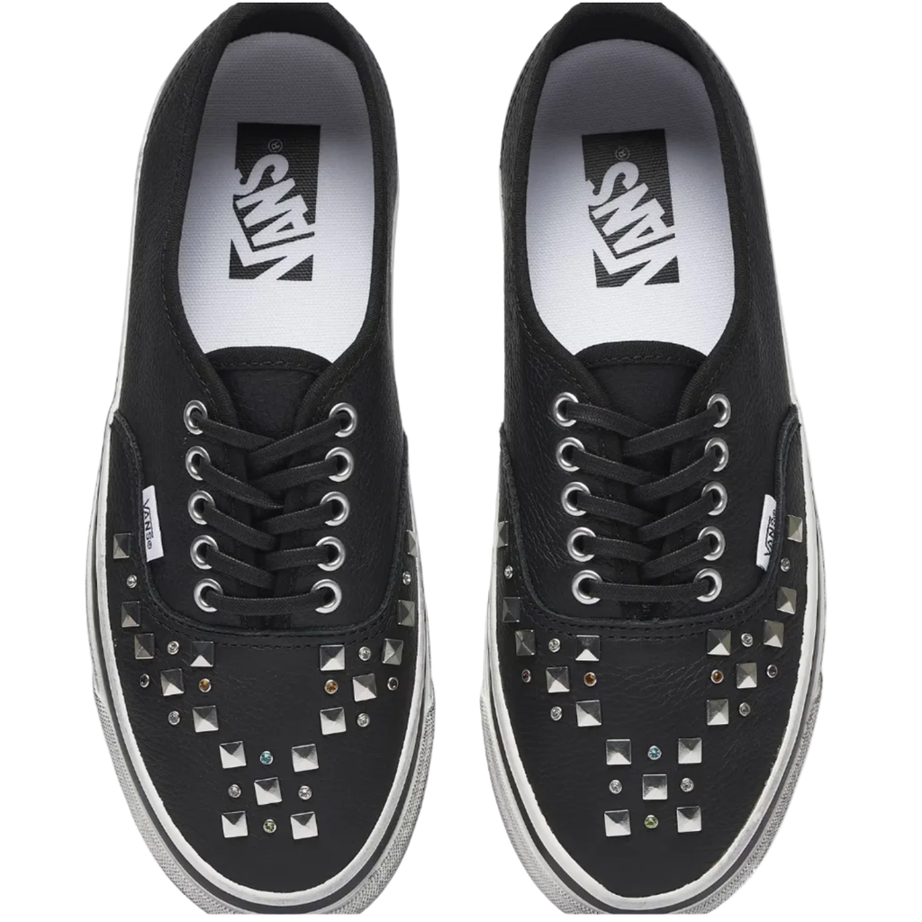 A pair of black Vans platform sneakers with silver metal studs on the toe box, shown from a top-down view on a white background.